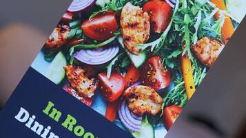 A menu titled "In Room Dining Menu" with a food image.