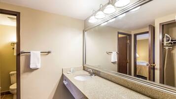 Suite, 1 King Bed with Sofa bed, Non Smoking | Bathroom | Combined shower/tub, free toiletries, hair dryer, towels