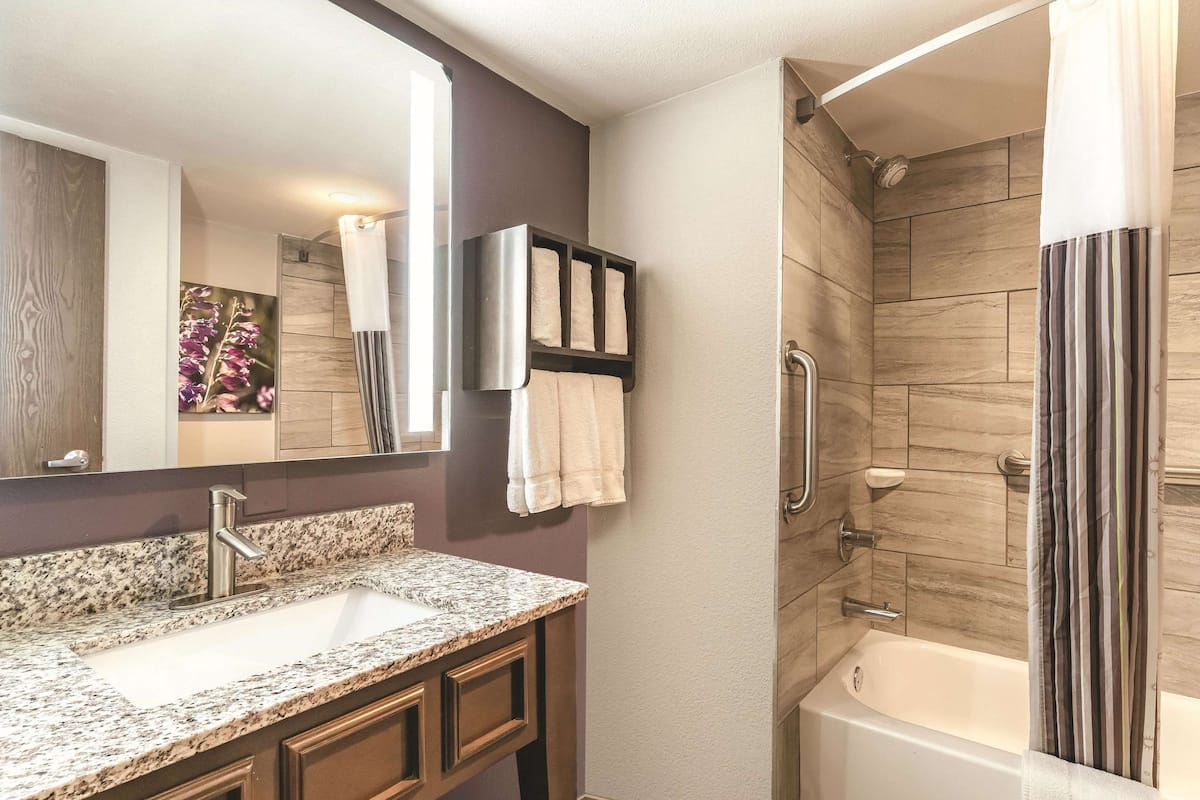 desk, laptop workspace, blackout curtains, iron/ironing board