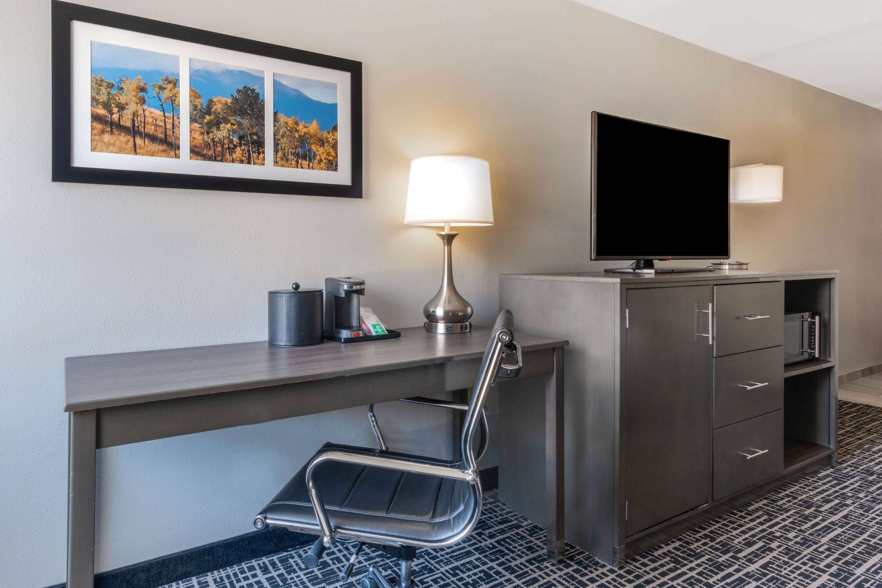 desk, laptop workspace, blackout curtains, iron/ironing board