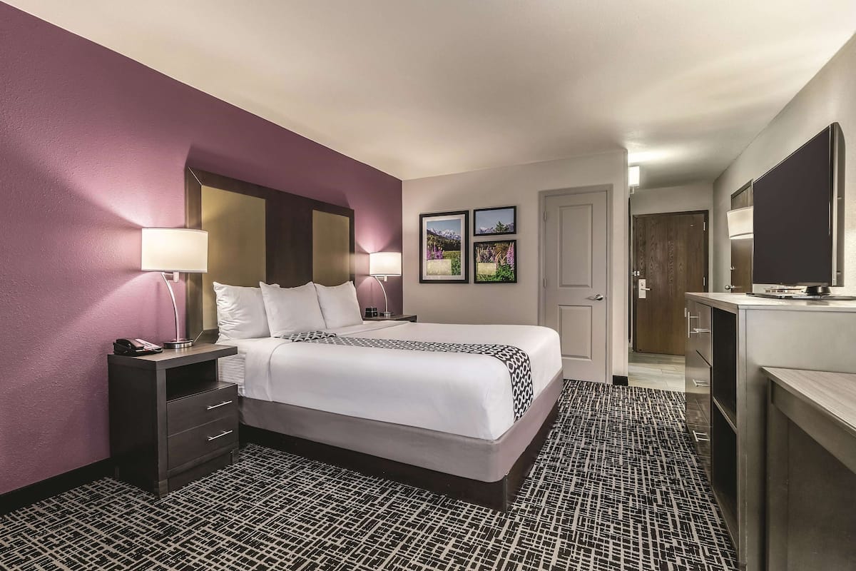 desk, laptop workspace, blackout curtains, iron/ironing board