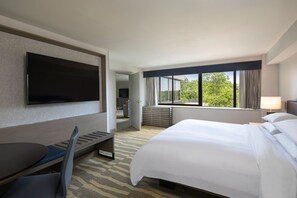 Premium bedding, desk, laptop workspace, blackout curtains