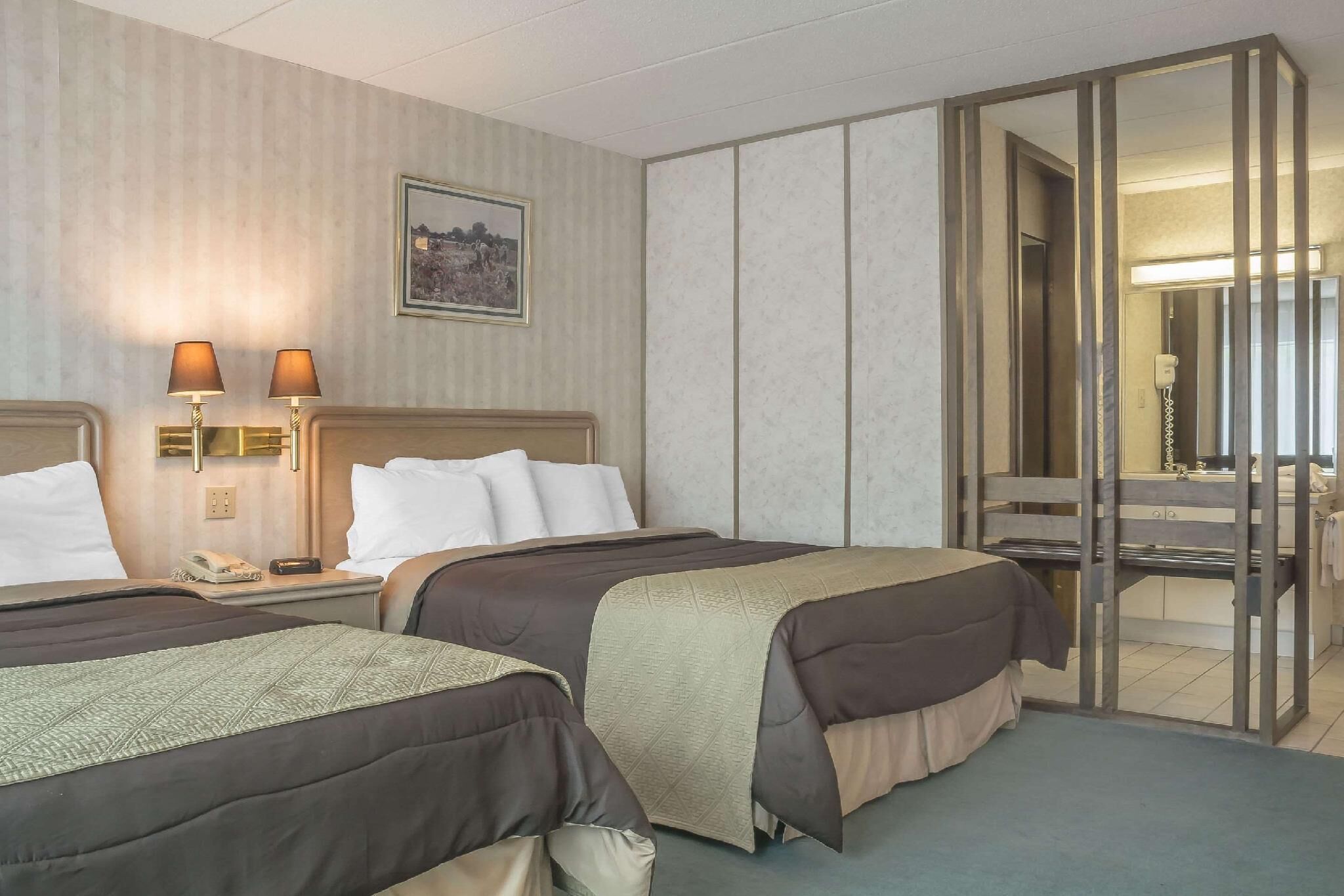 Desk, laptop workspace, blackout drapes, iron/ironing board