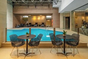 Indoor pool, open 9:00 AM to 10:00 PM, pool loungers