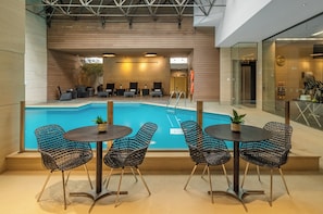 Indoor pool, open 9:00 AM to 10:00 PM, pool loungers