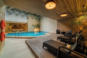 Indoor pool, open 9:00 AM to 10:00 PM, sun loungers