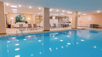 Indoor pool, open 6:00 AM to 11:00 PM, pool umbrellas, sun loungers
