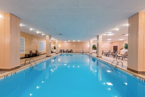Indoor pool, open 6:00 AM to 11:00 PM, pool umbrellas, pool loungers
