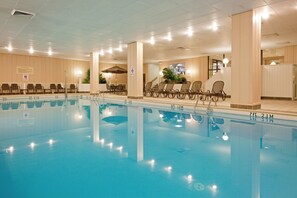 Indoor pool, pool umbrellas, pool loungers