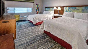A hotel room with two beds, a desk, a TV, and a window with blinds. - Hampton Inn Cardiff Beach Encinitas, CA Near Del Mar (Cardiff-by-the-Sea)