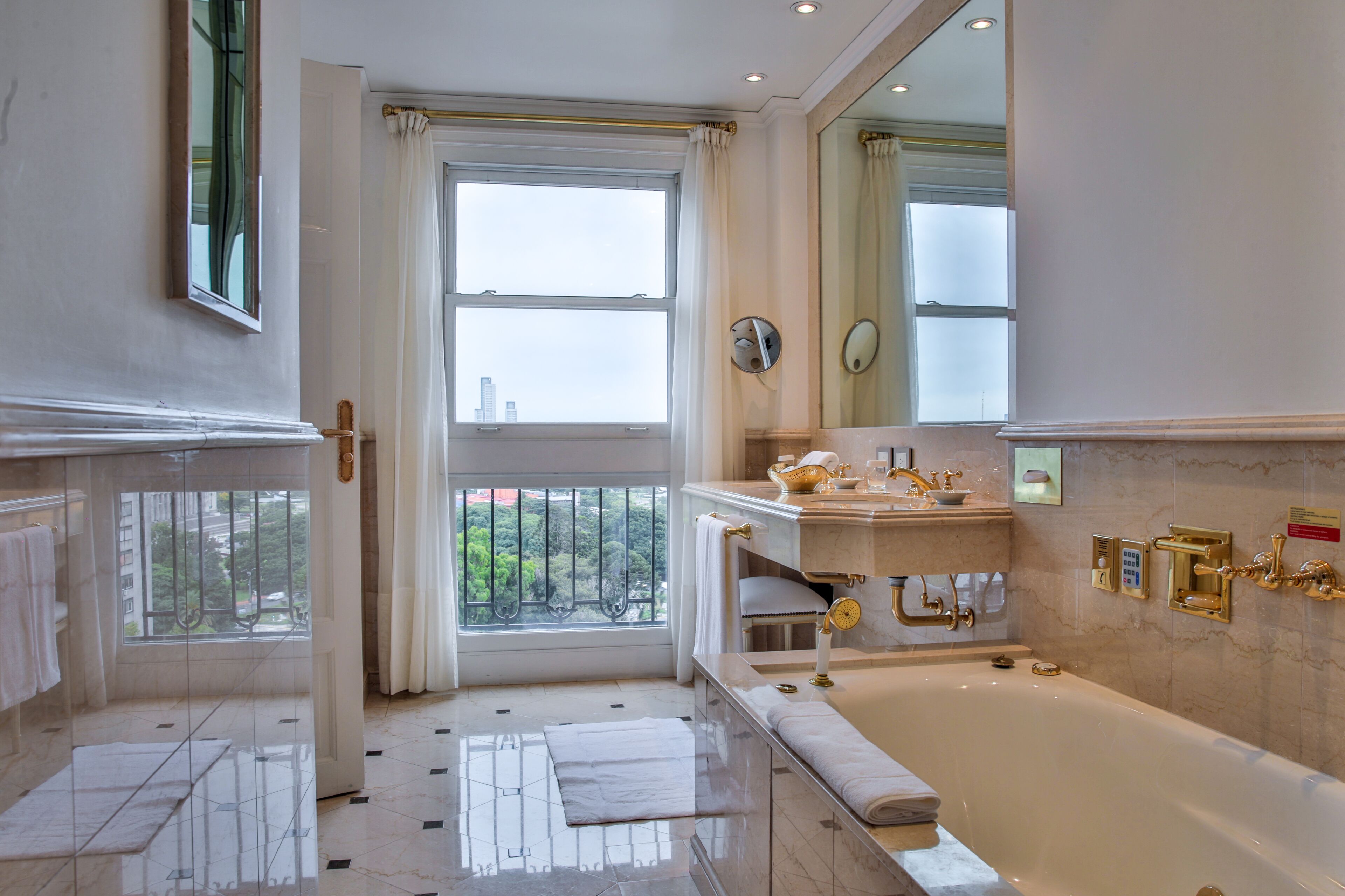 junior suite (prestige) | bathroom | separate bathtub and shower, jetted bath, rainfall showerhead