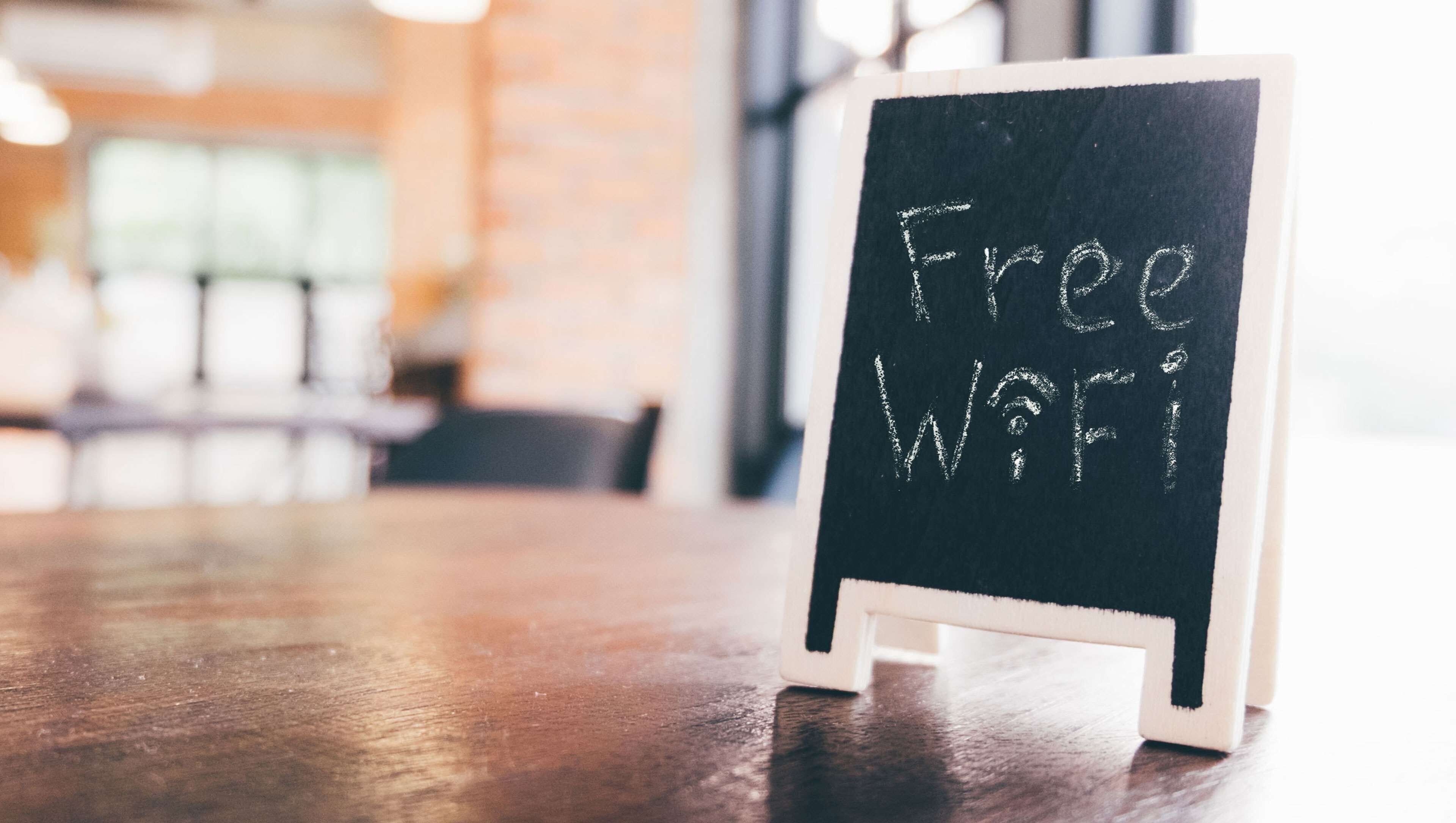 A blackboard with "Free WiFi" written on it.