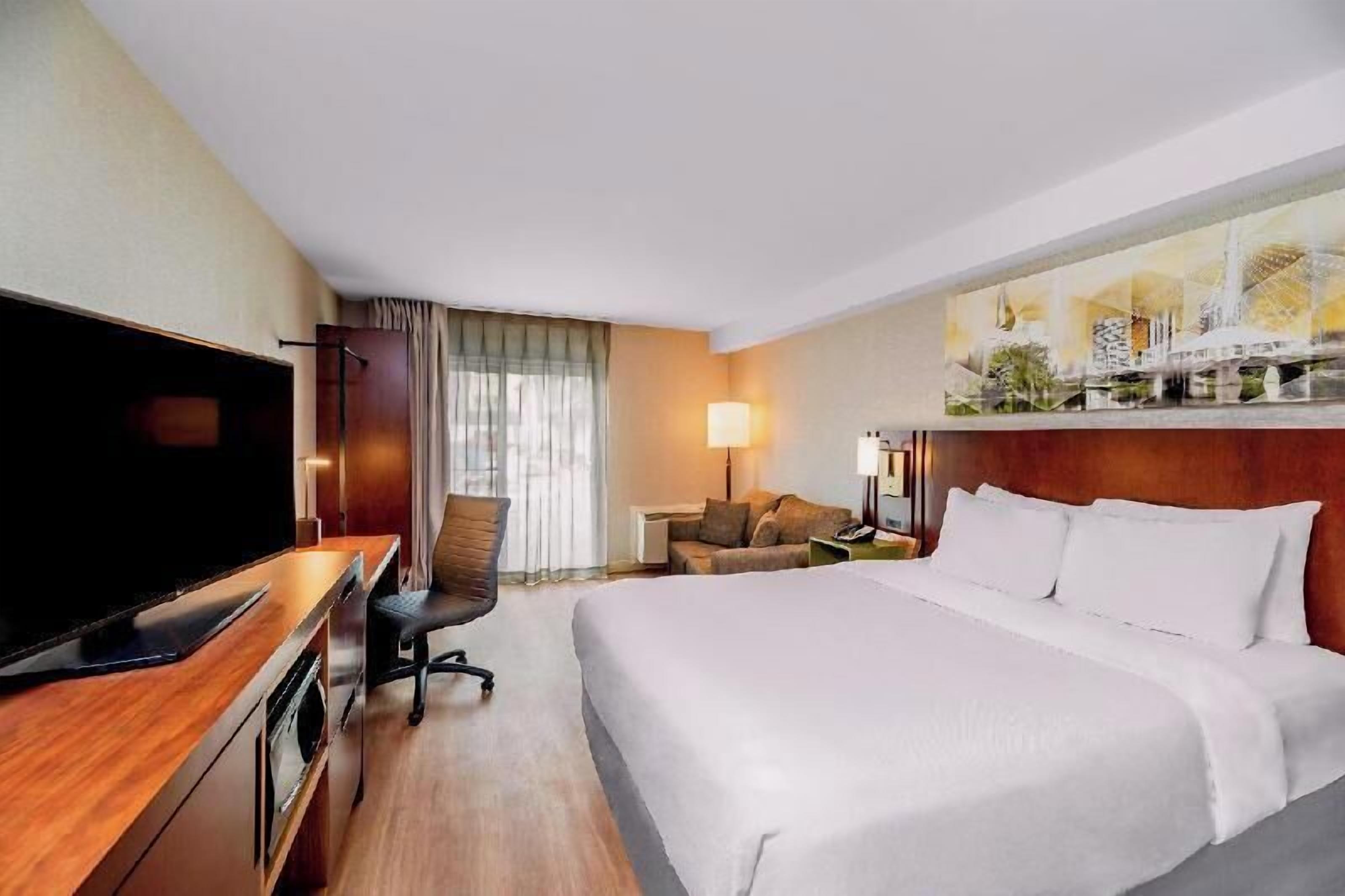 Premium bedding, pillowtop beds, desk, laptop workspace