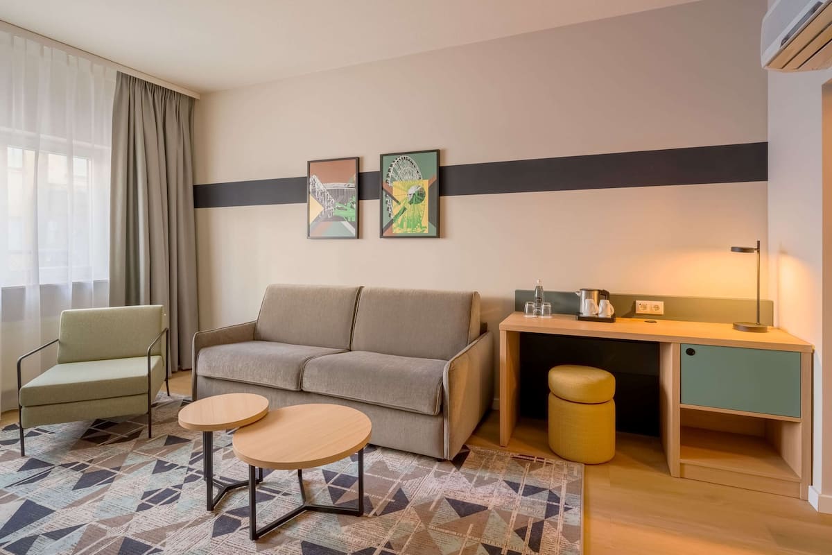 Room, 1 King Bed with Sofa bed | Minibar, in-room safe, desk, laptop workspace