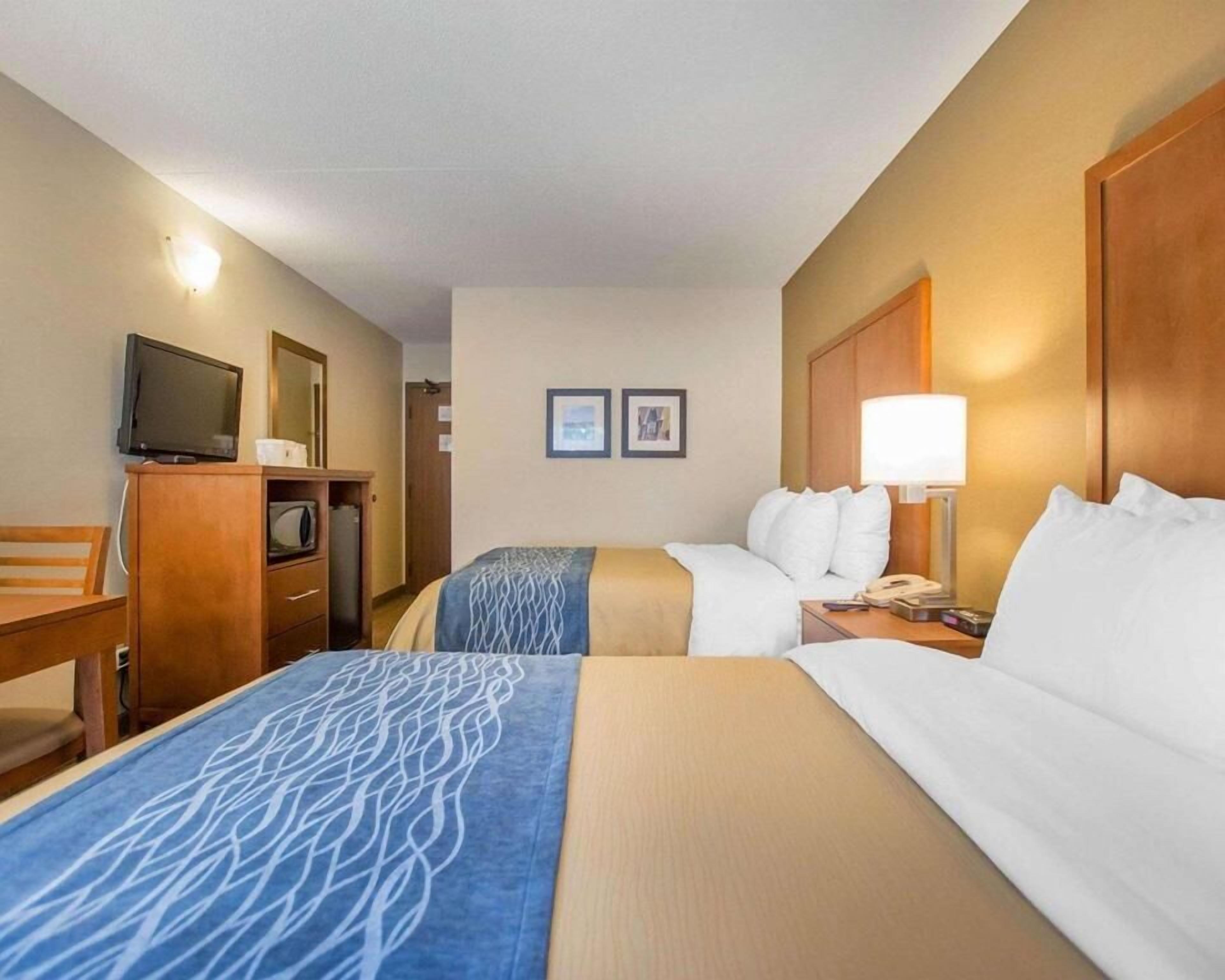 Down duvets, pillow-top beds, desk, blackout curtains