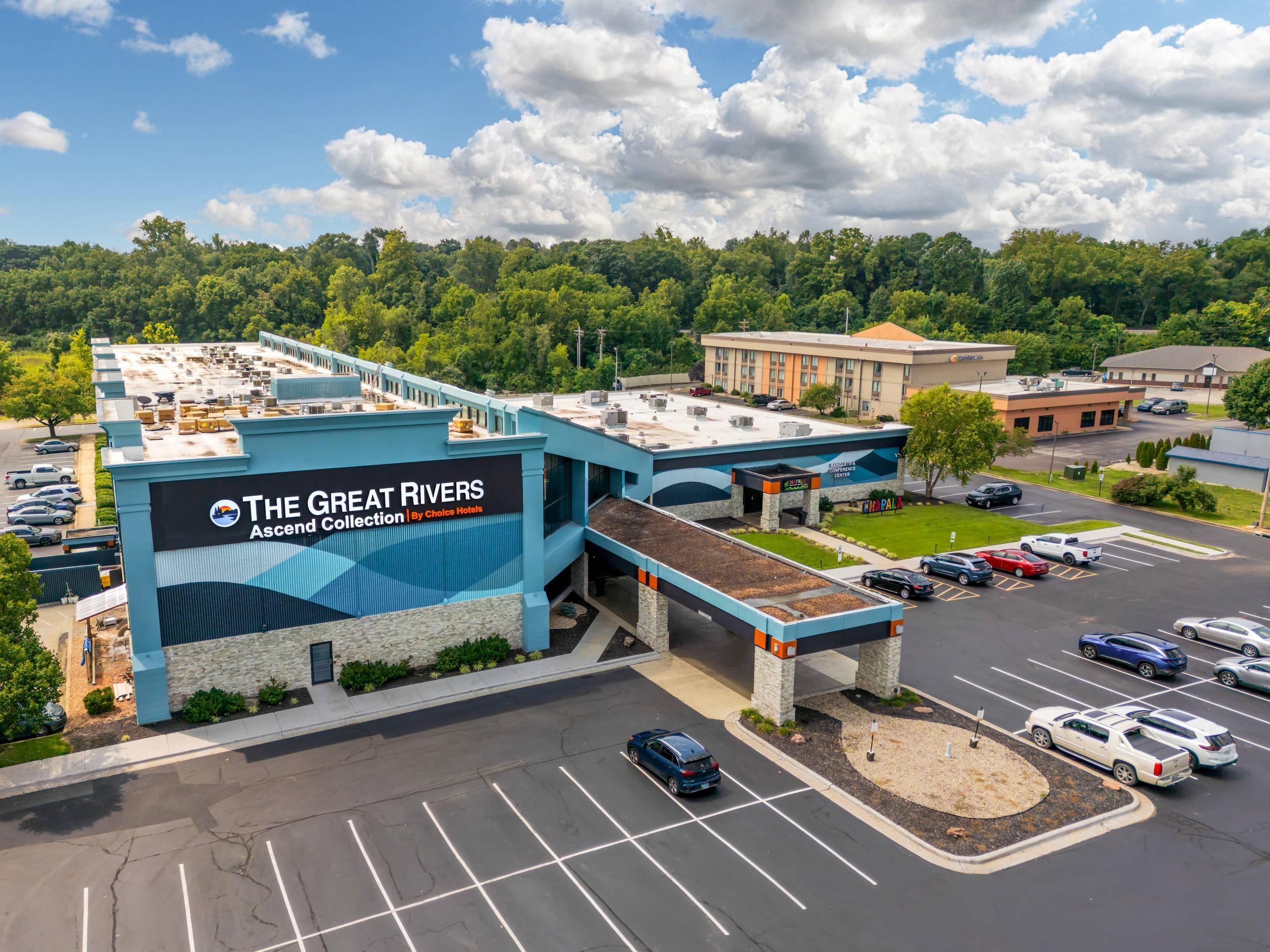 A hotel with a prominent sign for 'The Great Rivers Ascend Collection By Choice Hotels'.
