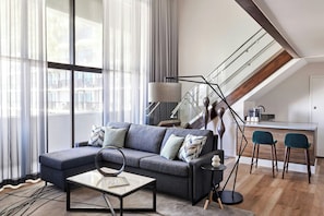 Suite, 1 Bedroom | Living area | 55-inch Smart TV with cable channels, TV, pay movies