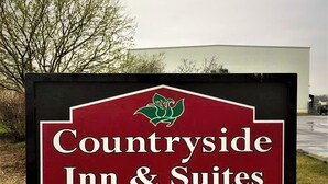 A sign for Countryside Inn & Suites with a logo, an 'ENTER' arrow, and a 'EDIT & SEND' button.
