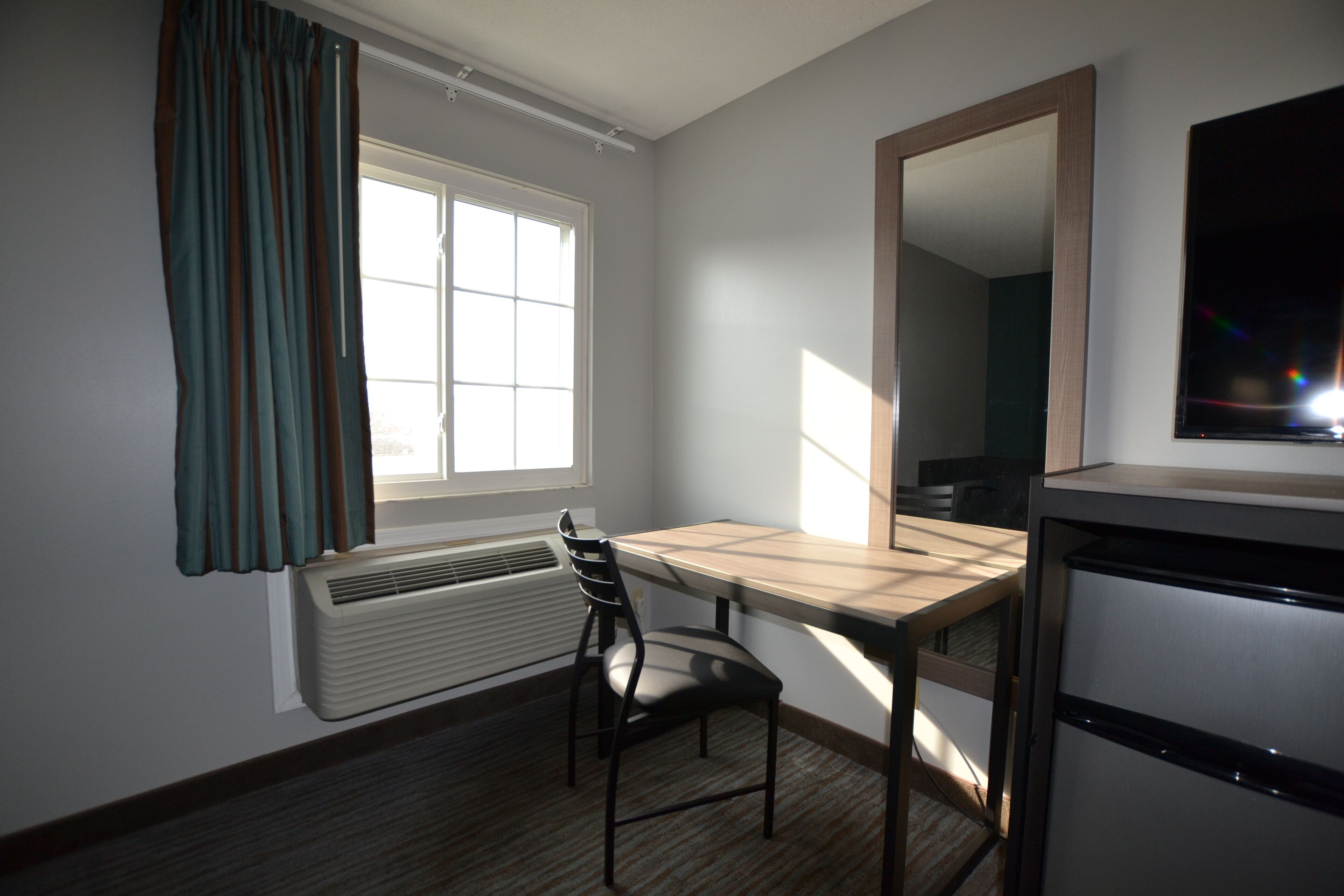 Desk, laptop workspace, blackout drapes, iron/ironing board