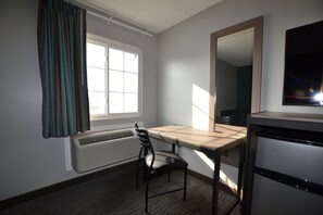 Desk, laptop workspace, blackout drapes, iron/ironing board
