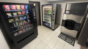 A vending machine with snacks and a water dispenser.