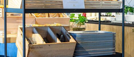 A bakery display with croissants and a sign about a small, authentic experience.