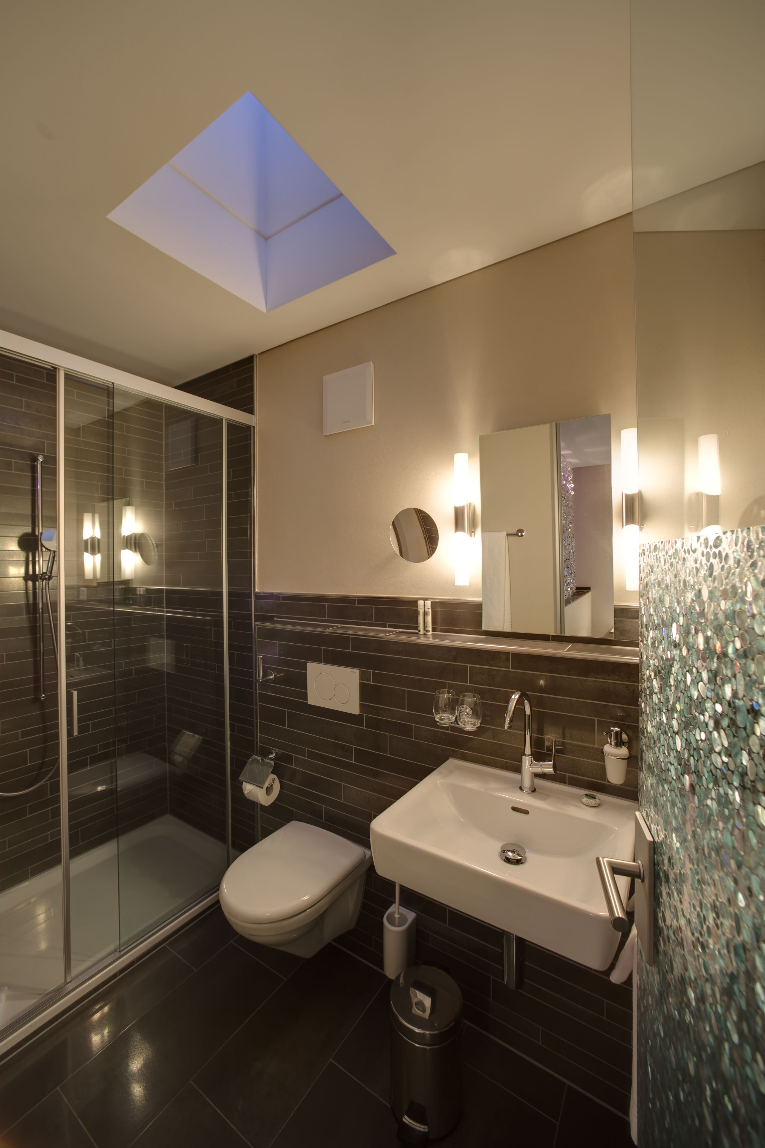 bellevue apartment | bathroom | hair dryer, slippers, towels, soap