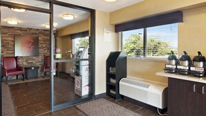 A Red Roof Inn's interior with an ATM, a grill station, and a view of the outdoors. - Red Roof Inn Fairmont (Fairmont)