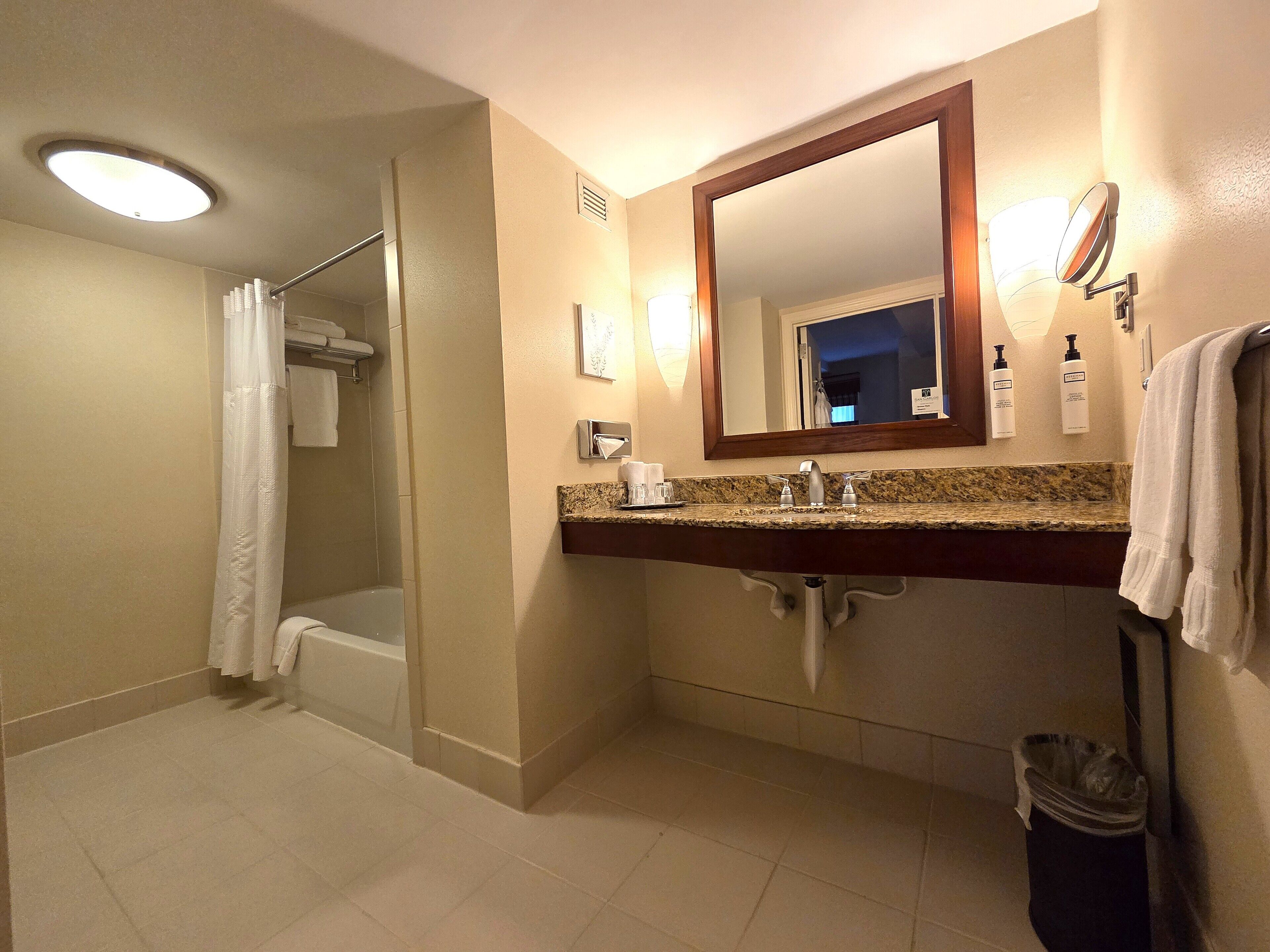 elite suite,1 queen,1 bedroom apartment,separate adjoining living space and sofa bed, accessible/ada | bathroom | combined shower/bathtub, hair dryer, bathrobes, towels