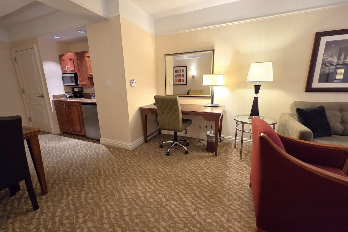 elite suite,1 queen,1 bedroom apartment,separate adjoining living space and sofa bed, accessible/ada | living area | 42-inch led tv with cable channels, tv, pay films