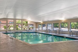 An indoor swimming pool with clear views of the outdoors through large windows. - Country Inn & Suites by Radisson, Atlanta Galleria/Ballpark, GA (Atlanta)