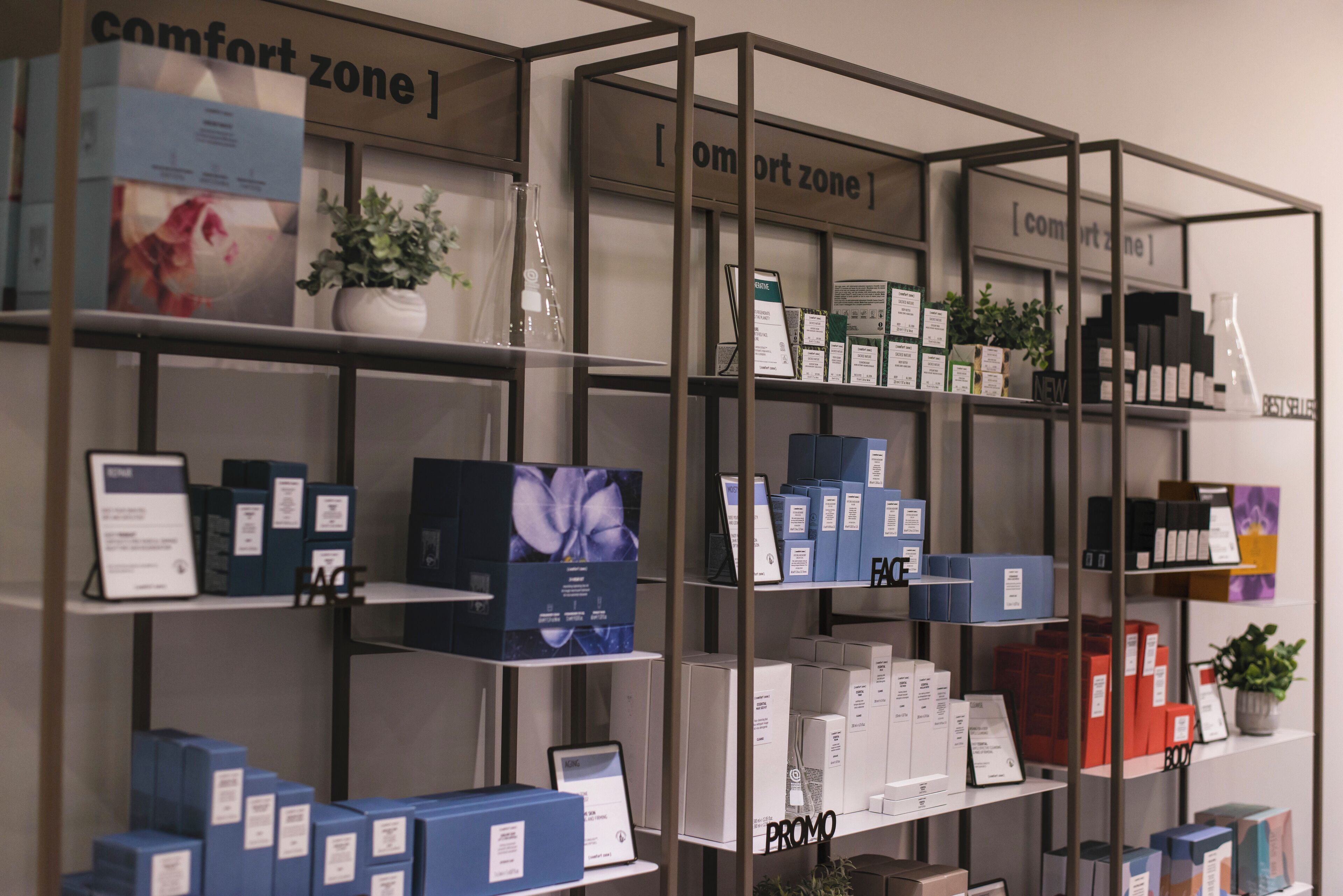 A display of products on shelves with labels such as "comfort zone" and "promo".