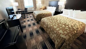 A hotel room with two beds, a desk with a computer, a chair, and a TV. -  Econo Lodge Wausau - Rothschild (Rothschild)