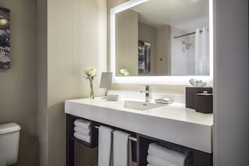 Combined shower/tub, designer toiletries, hair dryer, towels at Manchester Grand Hyatt San Diego