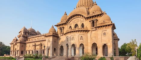 A large, ornate building with multiple domes and arches.