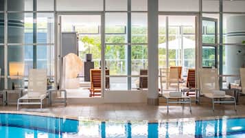 Indoor pool, open 6 AM to 10 PM, pool loungers