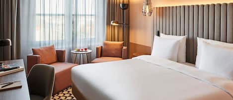 Luxe beddengoed, een minibar, een kluis op de kamer, een bureau