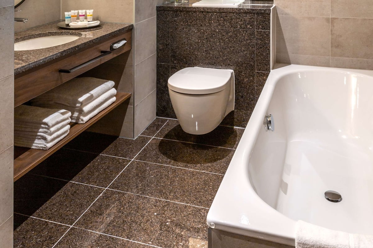 eco-friendly toiletries, hair dryer, bathrobes, slippers