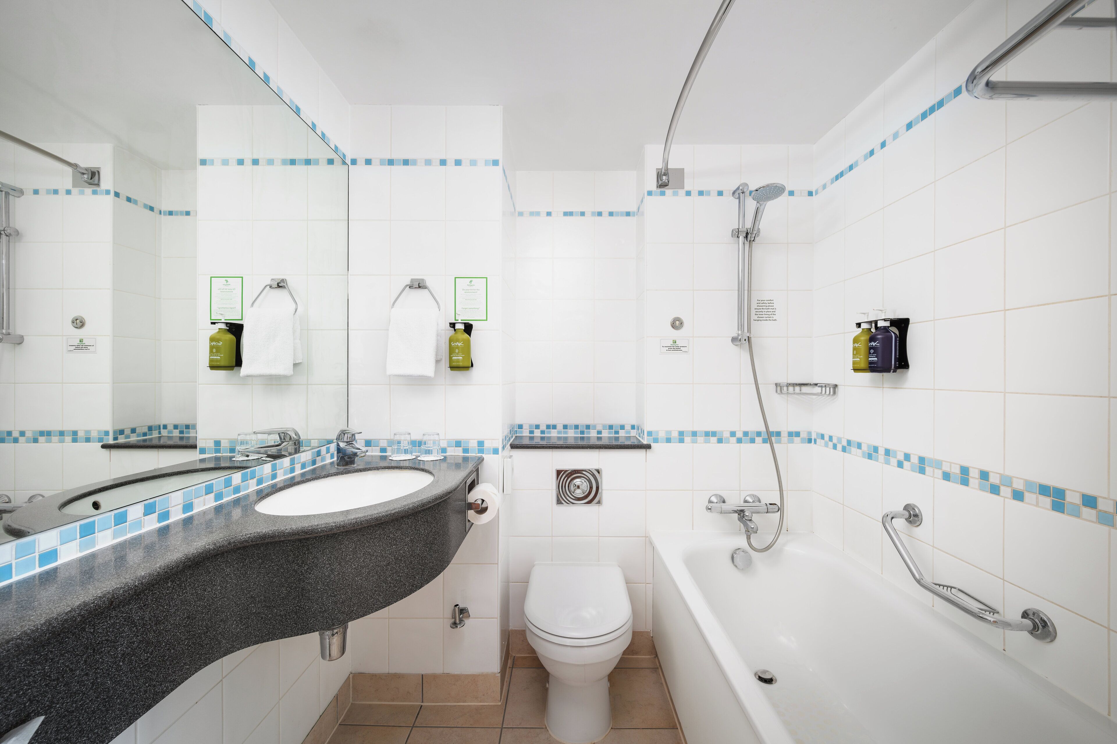 bathtub, hair dryer, towels