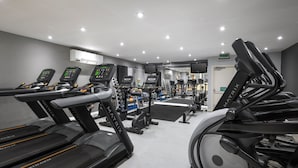 A gym with treadmills, exercise bikes, and weight machines. - Holiday Inn Norwich by IHG (Norwich)