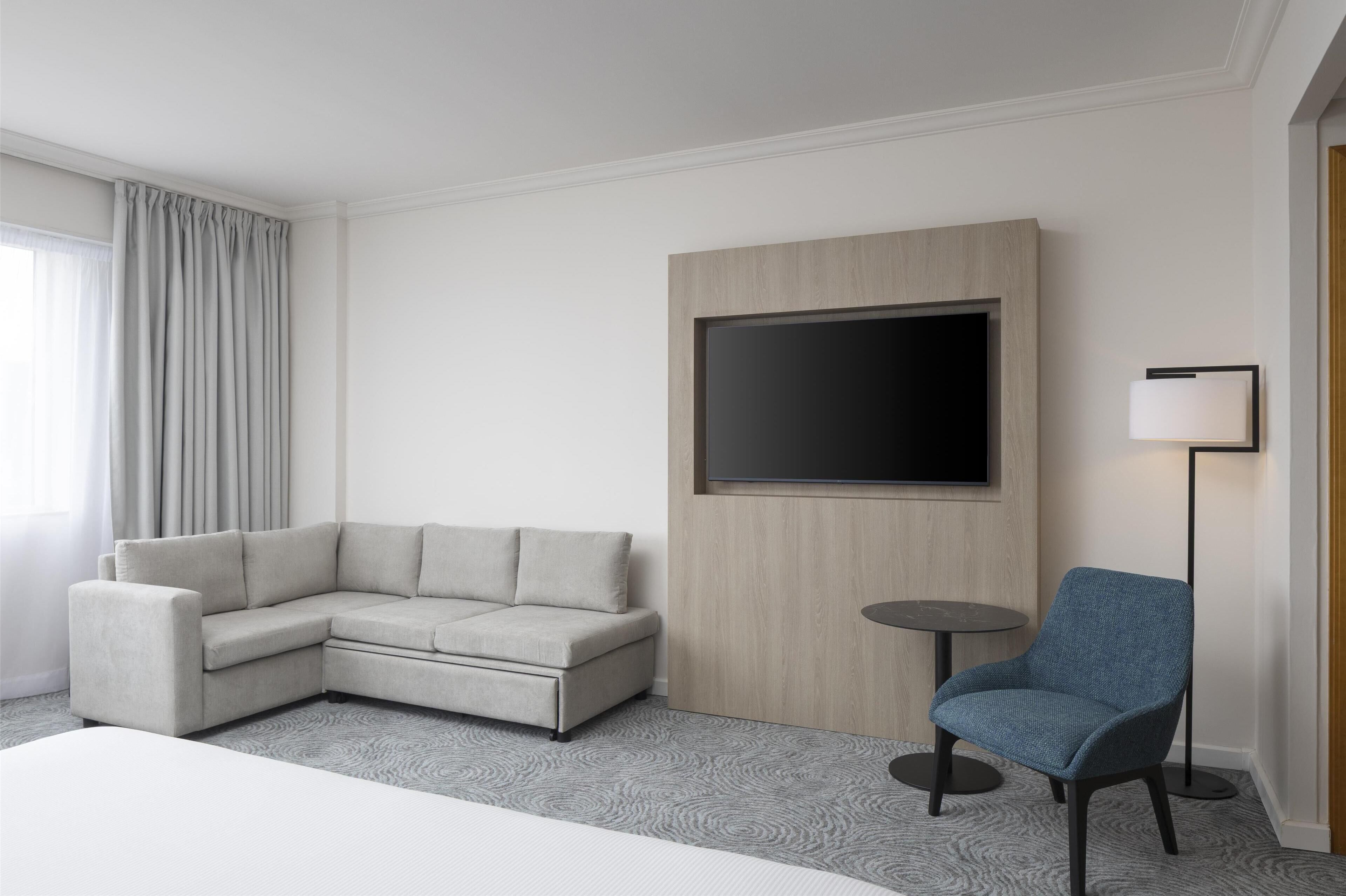 familly executive room, 1 king bed (plus, newly renovated) | living area | 42-inch tv with satellite channels