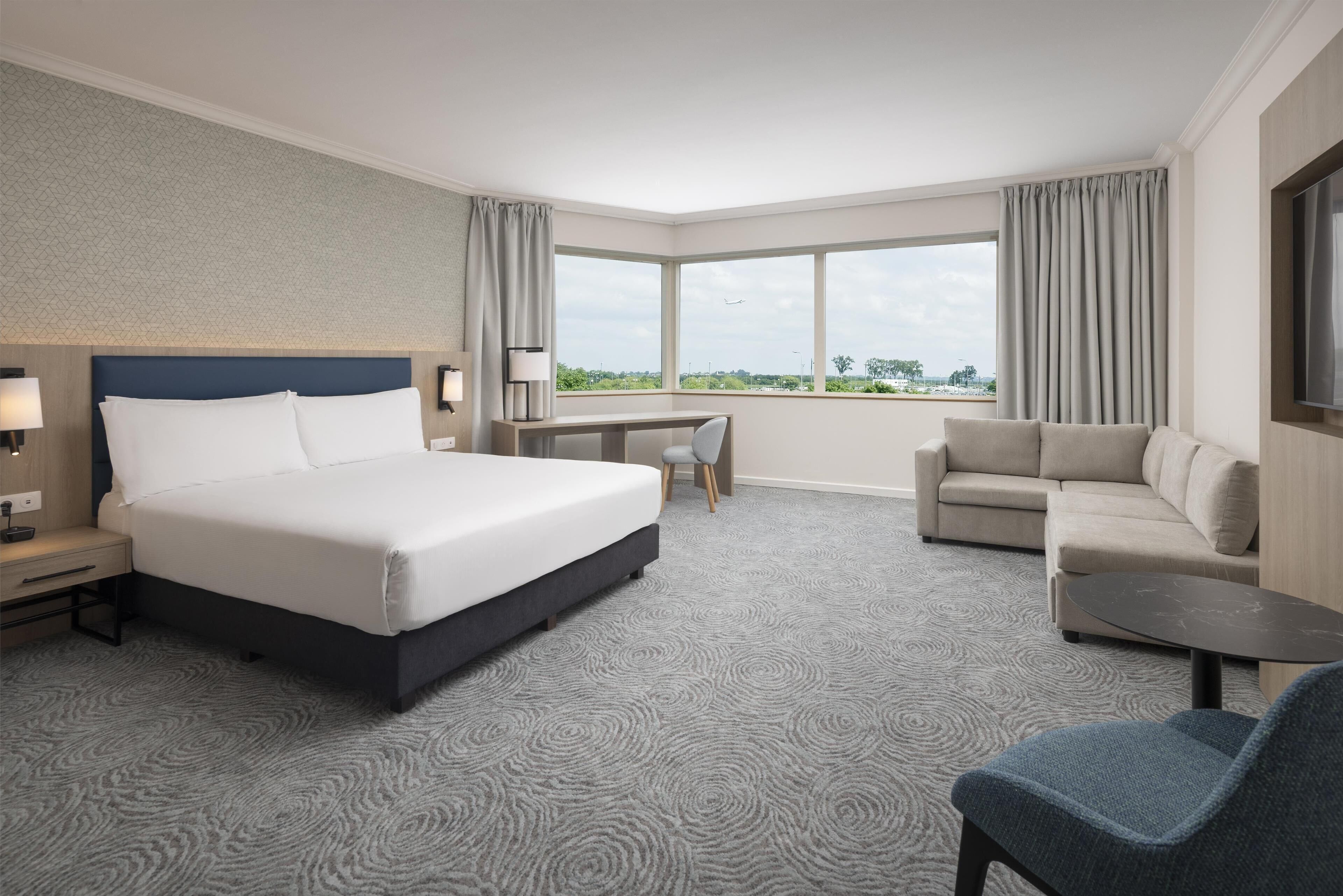 familly executive room, 1 king bed (plus, newly renovated) | living area | 42-inch tv with satellite channels