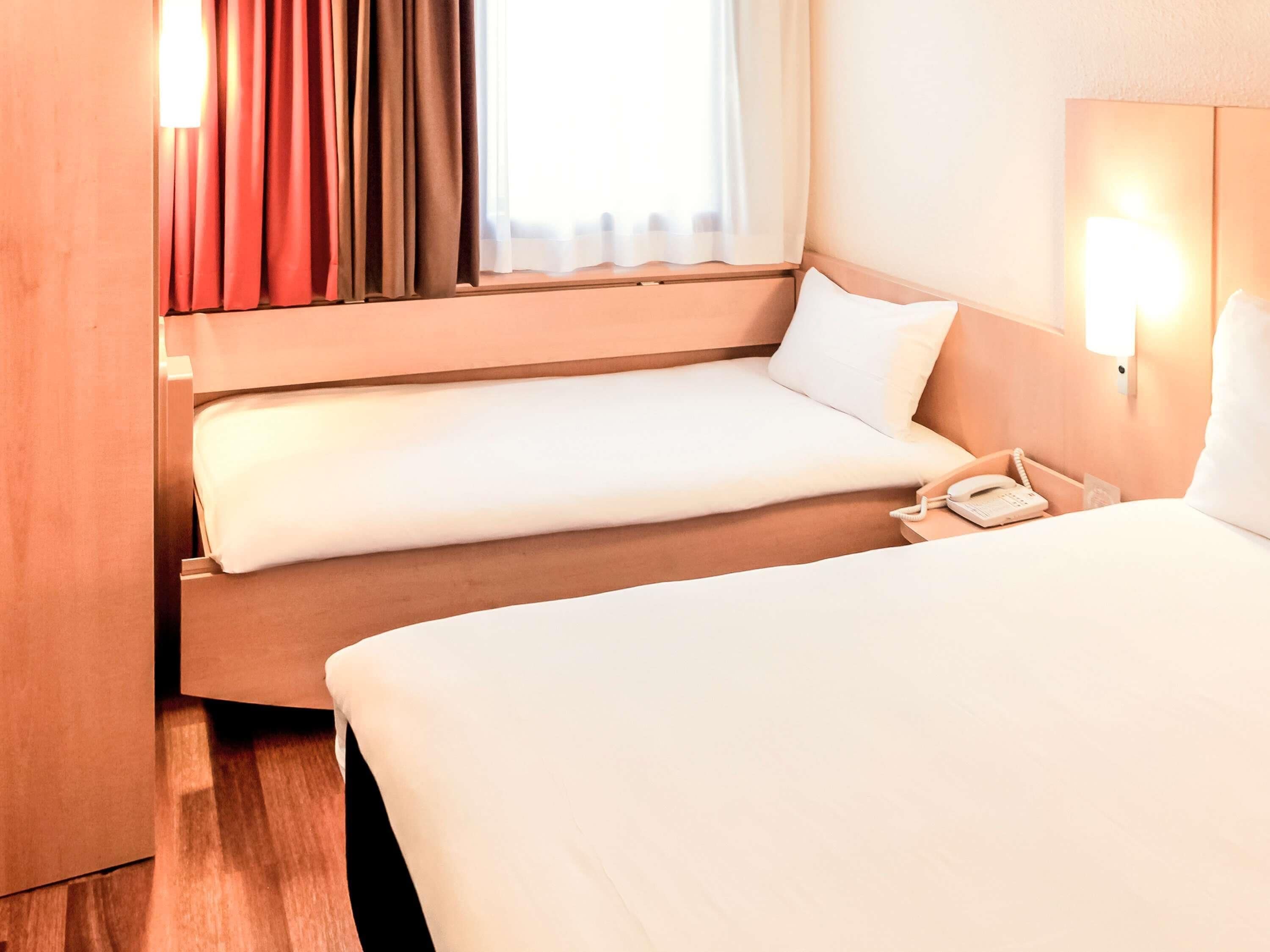 Premium bedding, pillow-top beds, desk, blackout curtains