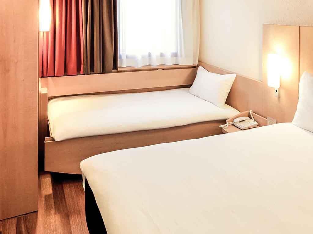 Premium bedding, pillow-top beds, desk, blackout curtains