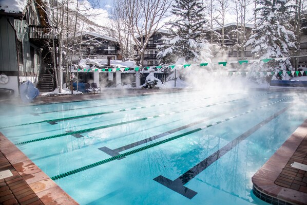 Outdoor pool, open 6:00 AM to 9:00 PM, pool umbrellas, pool loungers