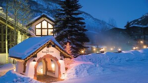 A snow-covered building with a sign reading "Vail Racquet Club" and a snow-covered entrance. - Vail Racquet Club Mountain Resort (Vail)