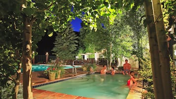 Outdoor pool, open 6:00 AM to 9:00 PM, pool umbrellas, pool loungers