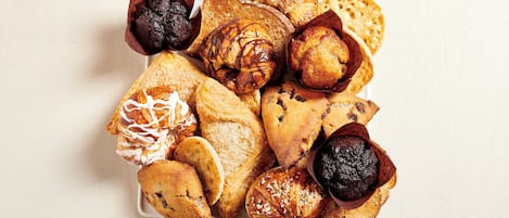 A variety of pastries and baked goods arranged on a plate.