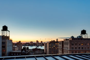 Junior Suite with Balcony | Premium bedding, down comforters, pillowtop beds, in-room safe at Arthouse Hotel New York City