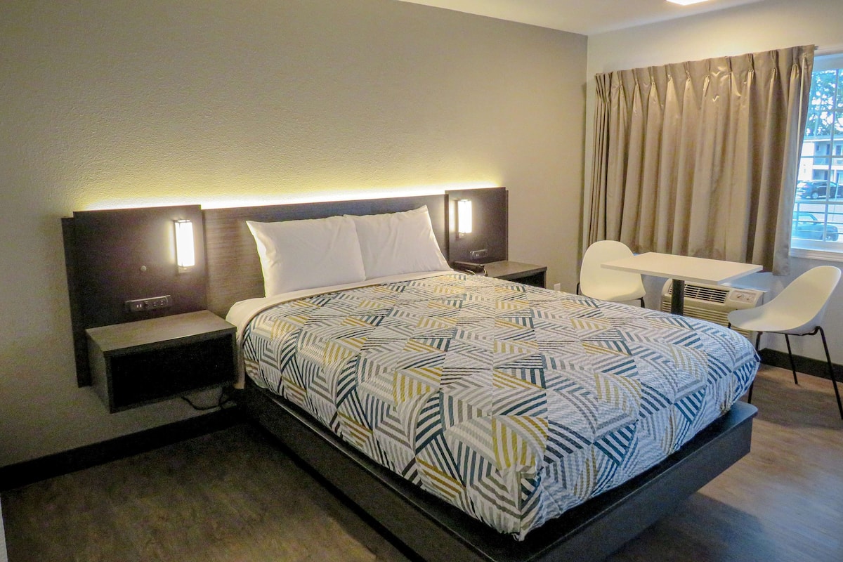 Desk, laptop workspace, blackout curtains, iron/ironing board